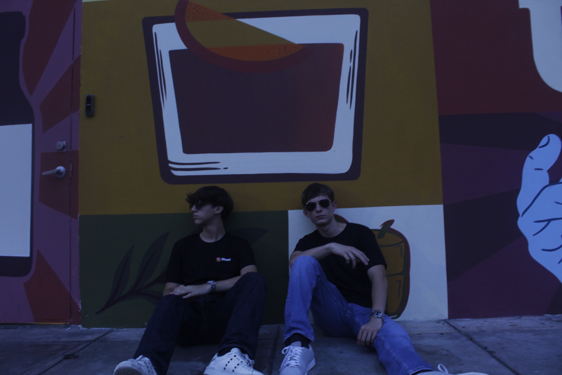Luca G. Melillo and a Liftrank co-founder wearing Liftrank shirts in Panama City